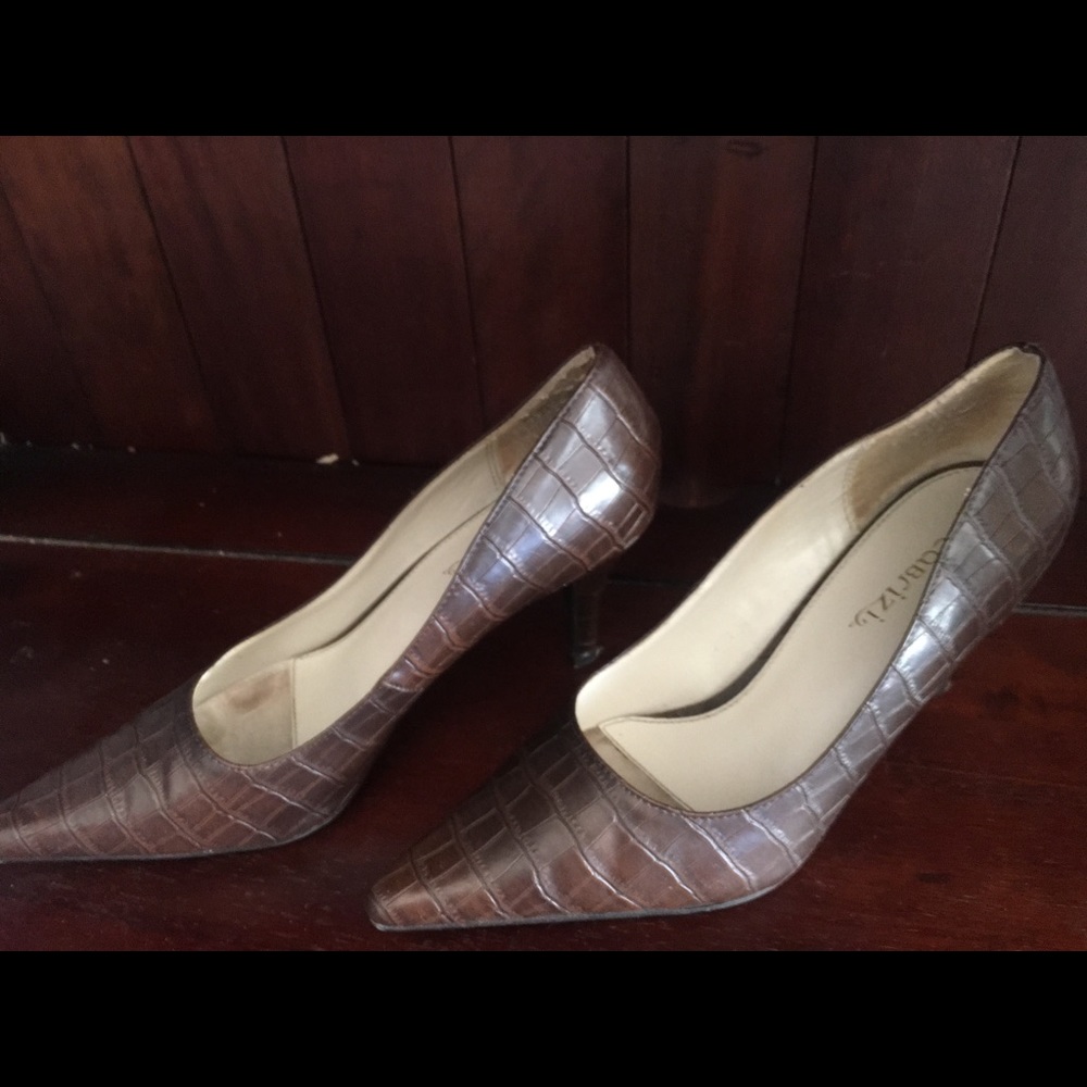 Brown textured work pumps.